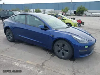 2021 Tesla Model 3 Long Range with VIN 5YJ3E1EB6MF878411, listed as a IAAI auction lot 41986947 with 71,978 mi miles. Bid and sale history available at carsss.com. Image 1.