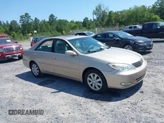 2003 Toyota Camry LE z VIN 4T1BF30K53U043266, wystawiony jako IAAI lot #42480079 z przebiegiem 273 710 mil mil oraz . Historia ofert i sprzedaży dostępna na DreamBid. Obrazek 1.