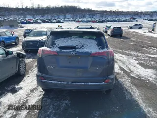 2017 Toyota RAV4 LE with VIN JTMZFREV9HJ119332, listed as a IAAI auction lot 41257790 with 94,992 mi miles and . Bid and sale history available at carsss.com. Image 16.