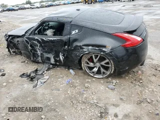 2014 Nissan 370Z Nismo z VIN JN1AZ4EH0EM634461, wystawiony jako Copart lot #53375685 z przebiegiem 171 858 mil mil oraz Szkoda całkowita • Salvage title. Historia ofert i sprzedaży dostępna na DreamBid. Obrazek 2.