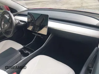 2020 Tesla Model 3 Standard Range Plus with VIN 5YJ3E1EA9LF718027, listed as a IAAI auction lot 41679320 with 68,987 mi miles. Bid and sale history available at carsss.com. Image 5.