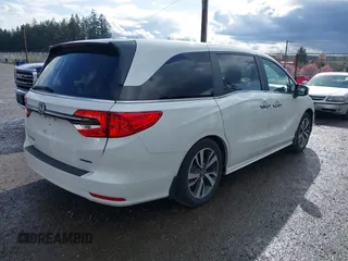 2021 Honda Odyssey Touring with VIN 5FNRL6H87MB015310, listed as a IAAI auction lot 41916339 with 58,808 mi miles. Bid and sale history available at carsss.com. Image 4.