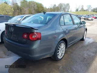 2009 Volkswagen Jetta Wolfsburg Edition with VIN 3VWRJ71K99M023071, listed as a IAAI auction lot 41853293 with 121,311 mi miles and . Bid and sale history available at DreamBid. Image 4.