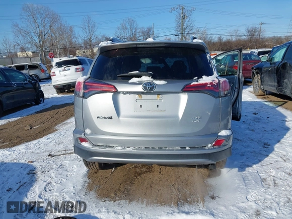 2018 Toyota RAV4 XLE with VIN 2T3RFREV8JW753853, listed as a IAAI auction lot 41526071 with 104,642 mi miles. Bid and sale history available at carsss.com. Image 17.