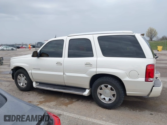 2005 Cadillac Escalade z VIN 1GYEK63N25R190908, wystawiony jako IAAI lot #41882135 z przebiegiem 243 333 mil mil oraz . Historia ofert i sprzedaży dostępna na DreamBid. Obrazek 14.