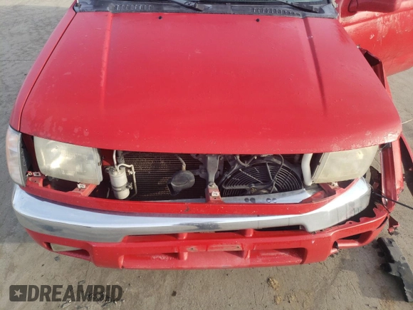 1999 Nissan Frontier XE with VIN 1N6ED26Y2XC312863, listed as a Copart auction lot 42259015 with 212,666 mi miles and Salvage title. Bid and sale history available at DreamBid. Image 12.