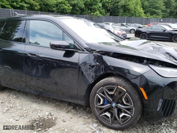 2024 BMW iX xDrive50 with VIN WB523CF09RCP70617, listed as a Copart auction lot 58091014 with 2,539 mi miles and Salvage Title. Bid and sale history available at carsss.com. Image 4.