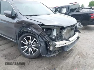 2019 Honda Pilot Touring 8-Passenger with VIN 5FNYF5H93KB028641, listed as a IAAI auction lot 42524078 with 56,744 mi miles and . Bid and sale history available at DreamBid. Image 6.