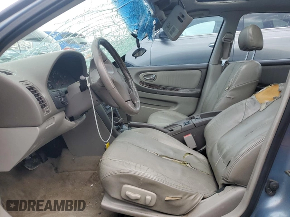 2000 Nissan Maxima GXE with VIN JN1CA31A1YT223132, listed as a Copart auction lot 60148655 with 269,258 mi miles and Salvage title. Bid and sale history available at DreamBid. Image 7.