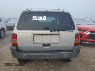 1997 Jeep Grand Cherokee Laredo with VIN 1J4GZ58Y6VC603370, listed as a Copart auction lot 82802794 with 0 mi miles and Salvage Title. Bid and sale history available at carsss.com. Image 6.