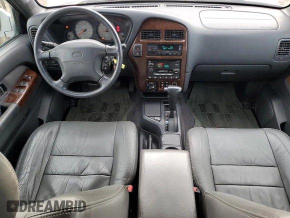 2000 Infiniti QX4 z VIN JNRAR07Y1YW083744, wystawiony jako Copart lot #80333404 z przebiegiem 191 863 mil mil oraz Czysty tytuł • Clean title. Historia ofert i sprzedaży dostępna na DreamBid. Obrazek 8.