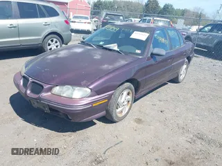 1998 Pontiac Grand Am SE with VIN 1G2NE52M1WC783104, listed as a IAAI auction lot 41911849 with 234,503 mi miles. Bid and sale history available at carsss.com. Image 2.