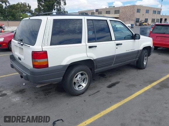 1996 Jeep Grand Cherokee Laredo with VIN 1J4FX58S5TC388512, listed as a IAAI auction lot 42803796 with 147,732 mi miles and . Bid and sale history available at DreamBid. Image 4.