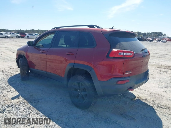 2015 Jeep Cherokee Trailhawk with VIN 1C4PJMBS1FW640483, listed as a IAAI auction lot 41883688 with 103,589 mi miles. Bid and sale history available at carsss.com. Image 3.