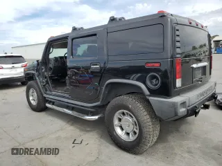 2005 Hummer H2 SUV with VIN 5GRGN23UX5H115383, listed as a Copart auction lot 71682984 with 157,405 mi miles and Salvage Title. Bid and sale history available at carsss.com. Image 2.