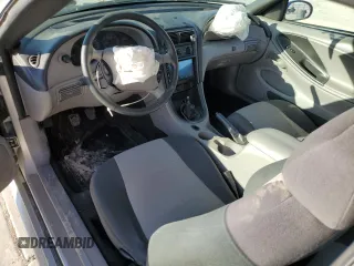 2003 Ford Mustang Standard z VIN 1FAFP40463F327722, wystawiony jako Copart lot #55042765 z przebiegiem 117 010 mil mil oraz Szkoda całkowita • Salvage title. Historia ofert i sprzedaży dostępna na DreamBid. Obrazek 8.