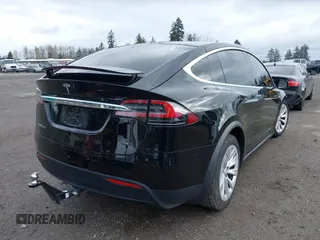 2016 Tesla Model X 70D with VIN 5YJXCBE20GF013046, listed as a IAAI auction lot 41944005 with 94,509 mi miles. Bid and sale history available at carsss.com. Image 4.