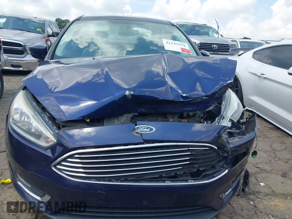 2016 Ford Focus Titanium z VIN 1FADP3J20GL208439, wystawiony jako IAAI lot #42145938 z przebiegiem 135 522 mil mil oraz . Historia ofert i sprzedaży dostępna na DreamBid. Obrazek 12.