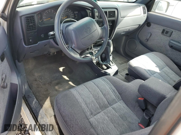 1999 Toyota Tacoma with VIN 4TAWN72N2XZ434256, listed as a Copart auction lot 49873685 with 285,424 mi miles and Salvage title. Bid and sale history available at DreamBid. Image 8.