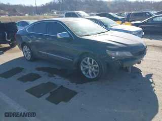 2014 Chevrolet Impala LTZ with VIN 2G1155S31E9105694, listed as a IAAI auction lot 41414595 with 128,828 mi miles. Bid and sale history available at carsss.com. Image 1.