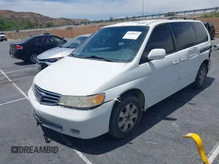 2003 Honda Odyssey EX-L z VIN 5FNRL18033B095684, wystawiony jako IAAI lot #42289617 z przebiegiem 174 336 mil mil oraz . Historia ofert i sprzedaży dostępna na DreamBid. Obrazek 2.