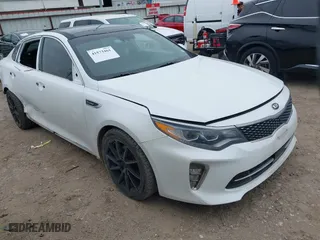 2018 Kia Optima SX with VIN 5XXGV4L23JG227199, listed as a IAAI auction lot 41573461 with 71,985 mi miles. Bid and sale history available at carsss.com. Image 1.