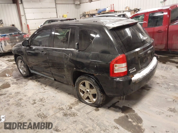2010 Jeep Compass Sport with VIN 1J4NF4FB0AD501897, listed as a IAAI auction lot 41570009 with 198,376 mi miles. Bid and sale history available at carsss.com. Image 3.