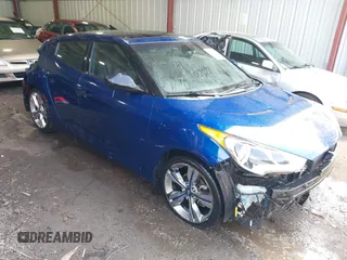 2015 Hyundai Veloster z VIN KMHTC6AD0FU245709, wystawiony jako IAAI lot #41941492 z przebiegiem 143 165 mil mil oraz . Historia ofert i sprzedaży dostępna na DreamBid. Obrazek 1.