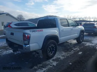 2023 Toyota Tacoma 4WD SR with VIN 3TMCZ5ANXPM599135, listed as a IAAI auction lot 41442577 with 26,901 mi miles. Bid and sale history available at carsss.com. Image 4.