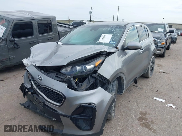 2020 Kia Sportage LX with VIN KNDPM3AC5L7720838, listed as a IAAI auction lot 41458808 with 52,689 mi miles and . Bid and sale history available at DreamBid. Image 2.