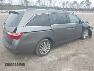 2011 Honda Odyssey EX with VIN 5FNRL5H49BB082706, listed as a IAAI auction lot 42080414 with 228,176 mi miles and . Bid and sale history available at carsss.com. Image 4.