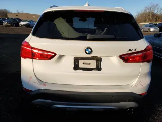 2017 BMW X1 xDrive28i with VIN WBXHT3C39H5F84369, listed as a Copart auction lot 68940992 with 92,054 mi miles. Bid and sale history available at carsss.com. Image 6.
