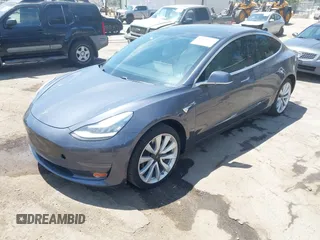 2020 Tesla Model 3 Standard Range Plus with VIN 5YJ3E1EAXLF615781, listed as a IAAI auction lot 42068935 with 96,026 mi miles. Bid and sale history available at carsss.com. Image 2.