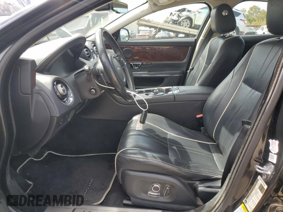 2018 Jaguar XJ with VIN SAJWA1C76J8W14271, listed as a Copart auction lot 73777914 with 124,155 mi miles and Salvage Title. Bid and sale history available at carsss.com. Image 7.