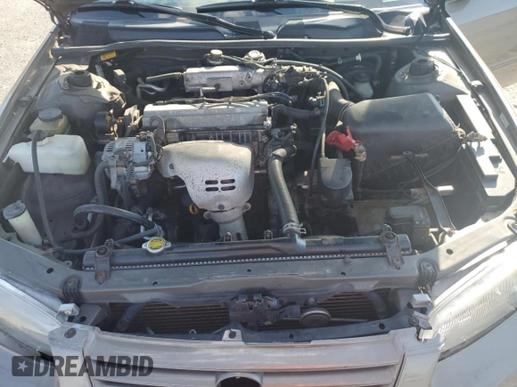 1999 Toyota Camry LE z VIN JT2BG22K0X0295893, wystawiony jako Copart lot #56183655 z przebiegiem 327 172 mil mil oraz Szkoda całkowita • Salvage title. Historia ofert i sprzedaży dostępna na DreamBid. Obrazek 11.