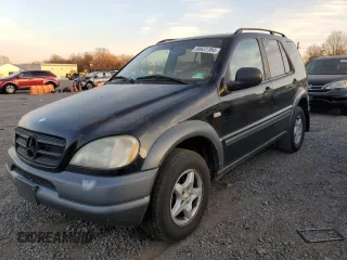 1999 Mercedes-Benz M-Class with VIN 4JGAB54E3XA092934, listed as a Copart auction lot 80631164 with 180,734 mi miles and Salvage Title. Bid and sale history available at carsss.com. Image 1.