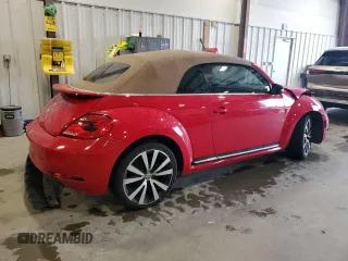 2015 Volkswagen Beetle with VIN 3VW7S7AT1FM822318, listed as a Copart auction lot 71398644 with 73,421 mi miles and Salvage Title. Bid and sale history available at DreamBid. Image 3.
