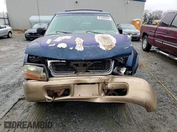 1999 GMC Jimmy SLE z VIN 1GKDT13W8X2545509, wystawiony jako Copart lot #81608944 z przebiegiem 130 881 mil mil oraz Szkoda całkowita • Salvage title. Historia ofert i sprzedaży dostępna na DreamBid. Obrazek 12.