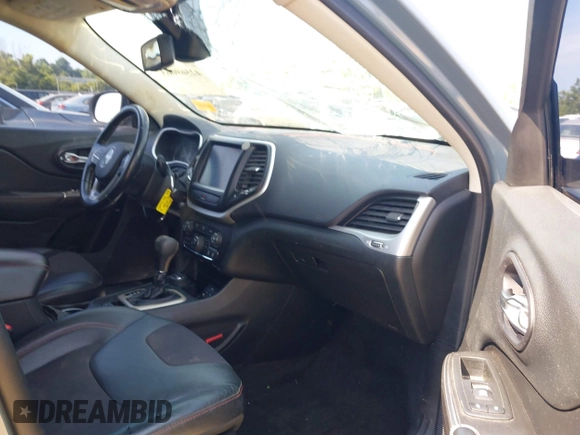 2014 Jeep Cherokee Trailhawk z VIN 1C4PJMBSXEW273520, wystawiony jako IAAI lot #42569063 z przebiegiem 137 585 mil mil oraz . Historia ofert i sprzedaży dostępna na DreamBid. Obrazek 5.