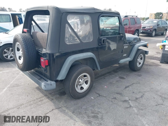 2002 Jeep Wrangler X with VIN 1J4FA39S92P774054, listed as a IAAI auction lot 41470351 with 209,727 mi miles. Bid and sale history available at carsss.com. Image 4.