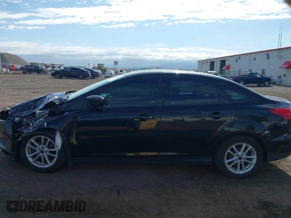 2018 Ford Focus SE z VIN 1FADP3F20JL288437, wystawiony jako IAAI lot #42278885 z przebiegiem 132 504 mil mil oraz . Historia ofert i sprzedaży dostępna na DreamBid. Obrazek 14.