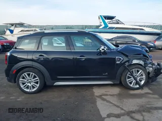 2019 MINI Countryman Cooper S z VIN WMZYT5C59K3G92620, wystawiony jako IAAI lot #41481981 z przebiegiem 51 904 mil mil oraz . Historia ofert i sprzedaży dostępna na DreamBid. Obrazek 13.