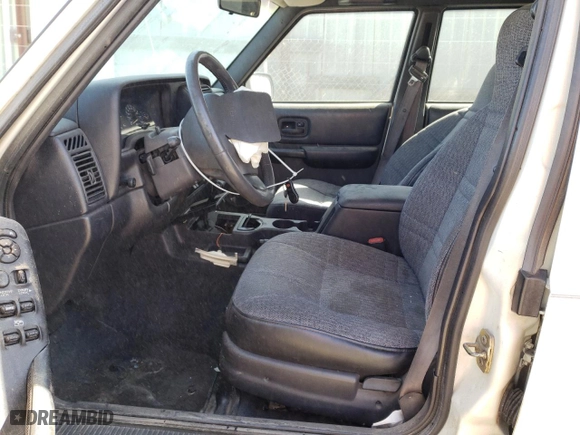 1999 Jeep Cherokee Sport with VIN 1J4FT68S9XL627003, listed as a Copart auction lot 49478595 with 320,444 mi miles and Salvage Title. Bid and sale history available at carsss.com. Image 7.