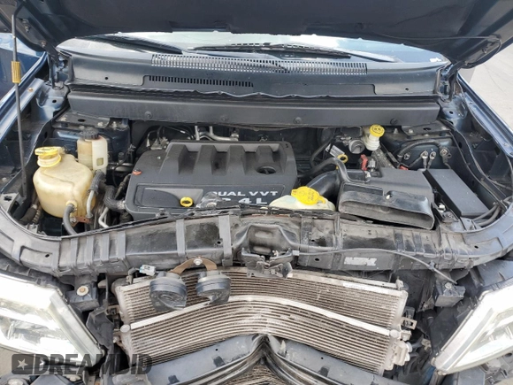 2013 Dodge Journey SE with VIN 3C4PDCAB7DT680055, listed as a Copart auction lot 58241435 with 199,620 mi miles and Salvage title. Bid and sale history available at DreamBid. Image 12.