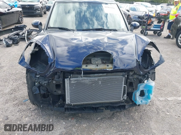 2013 MINI Countryman with VIN WMWZB3C58DWM07817, listed as a IAAI auction lot 41962291 with 60,763 mi miles and . Bid and sale history available at DreamBid. Image 6.