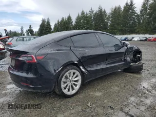 2023 Tesla Model 3 with VIN 5YJ3E1EA2PF457667, listed as a Copart auction lot 57360035 with 53,962 mi miles and Salvage title. Bid and sale history available at DreamBid. Image 3.