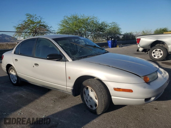 2000 Saturn SL with VIN 1G8ZH5281YZ242734, listed as a Copart auction lot 57433915 with Not provided miles and Salvage title. Bid and sale history available at DreamBid. Image 4.