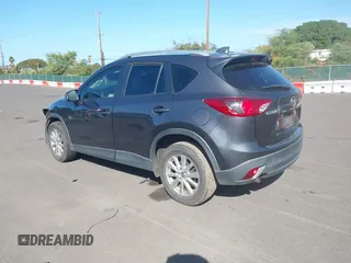 2014 Mazda CX-5 Sport with VIN JM3KE2BE4E0414721, listed as a IAAI auction lot 41408914 with Not Provided miles and . Bid and sale history available at carsss.com. Image 3.