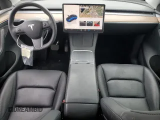 2023 Tesla Model Y Long Range with VIN 7SAYGAEE6PF689615, listed as a Copart auction lot 50999385 with 16,514 mi miles and Salvage Title. Bid and sale history available at DreamBid. Image 8.