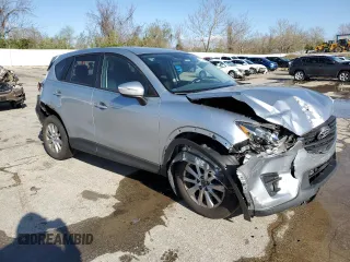 2016 Mazda CX-5 Touring with VIN JM3KE2CY8G0614335, listed as a Copart auction lot 52124465 with 218,320 mi miles and Salvage Title. Bid and sale history available at carsss.com. Image 4.
